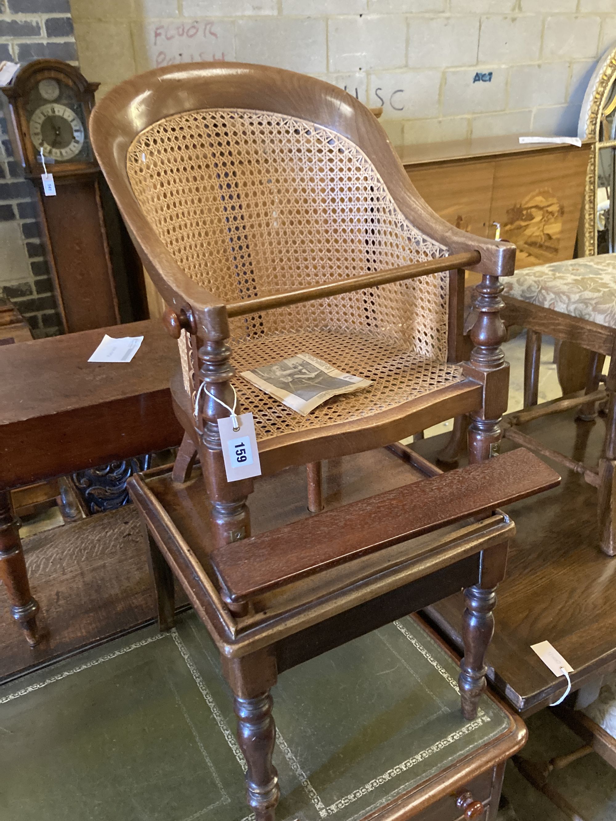 An early Victorian caned mahogany childs high chair on stand, width 42cm, depth 42cm, height 94cm